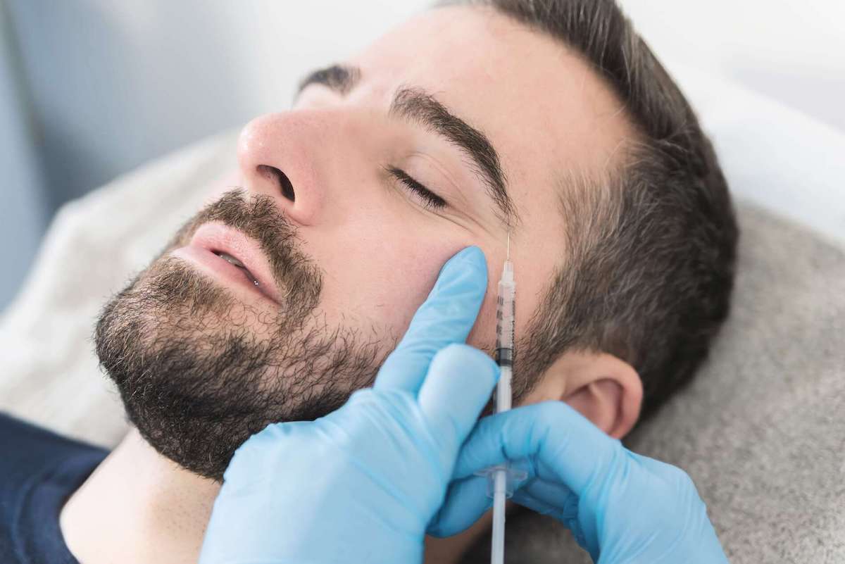 man receiving botox injections