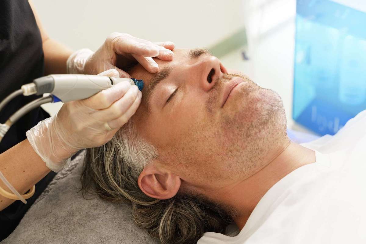 man receiving hydrafacial treatment